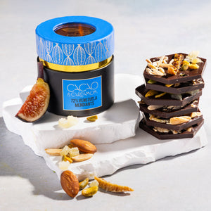 Close-up of 72% Venezuelan dark chocolate mendiants with artisan toppings.