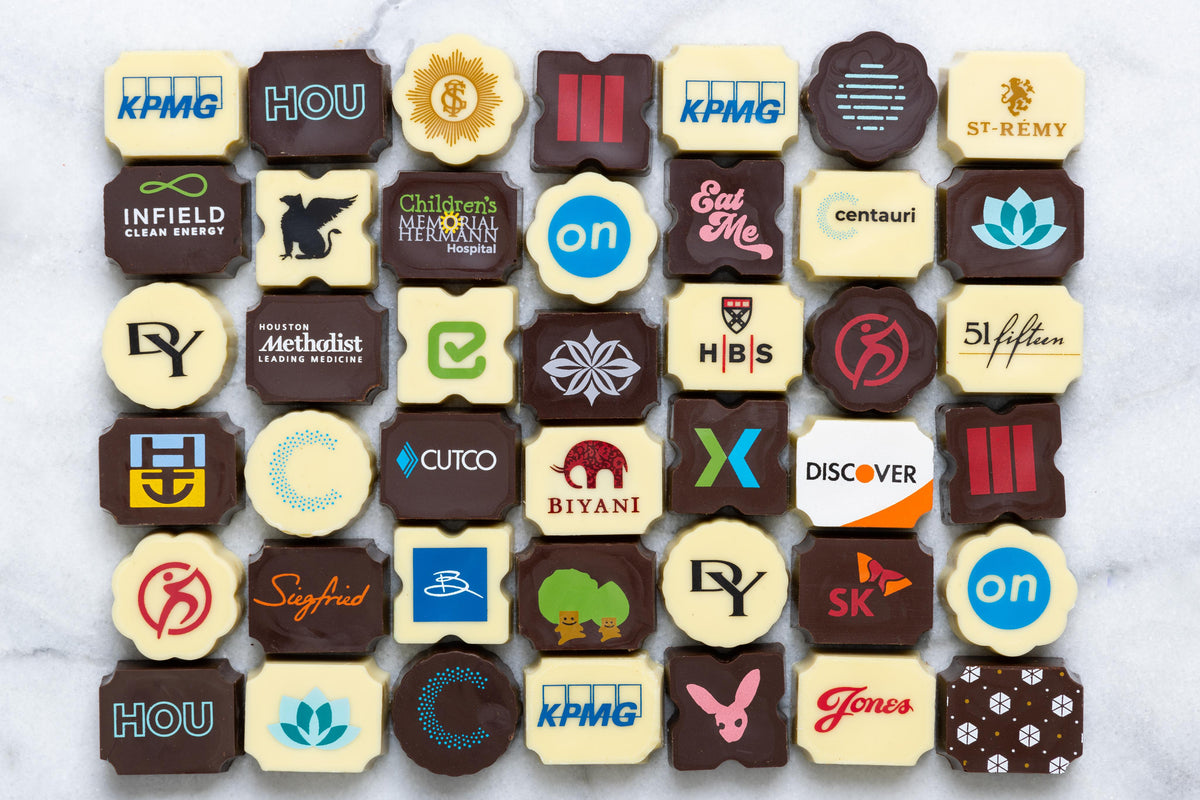 custom chocolate bonbons with various company logos and designs.
