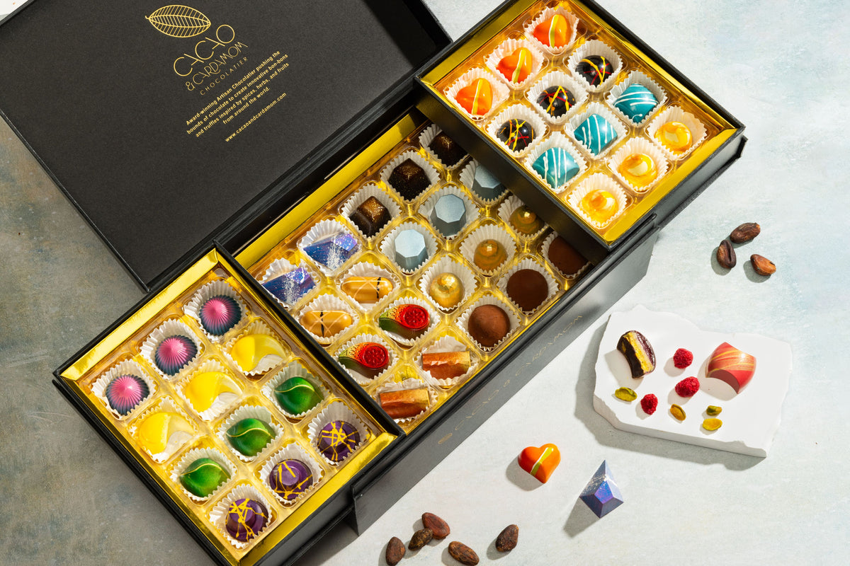 Open Deluxe Chocolate Gift Box displaying handcrafted gourmet chocolates.
