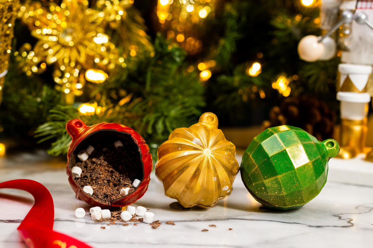 Front view of the Ornament Hot Chocolate Bomb showcasing its festive handcrafted chocolate design.