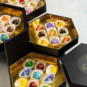 Assorted handcrafted gourmet chocolates from the Signature Chocolate Tasting Gift Set 36-piece by Cacao & Cardamom.