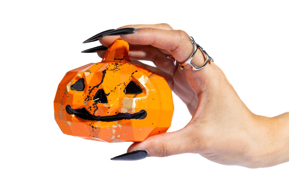 Open Smash Pumpkin handcrafted chocolate revealing gourmet treats inside.