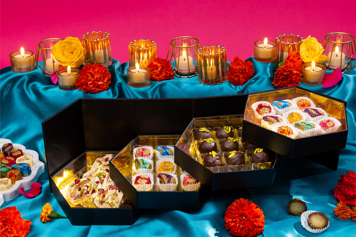 Open The Grand Mithai Platter displaying handcrafted artisan chocolates.
