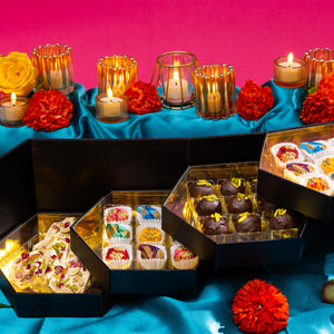 Open The Grand Mithai Platter displaying handcrafted artisan chocolates.