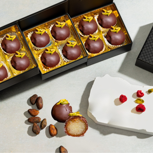 Open Chocolate Covered Gulab Jamun 12-piece gift box displaying handcrafted artisan chocolates.